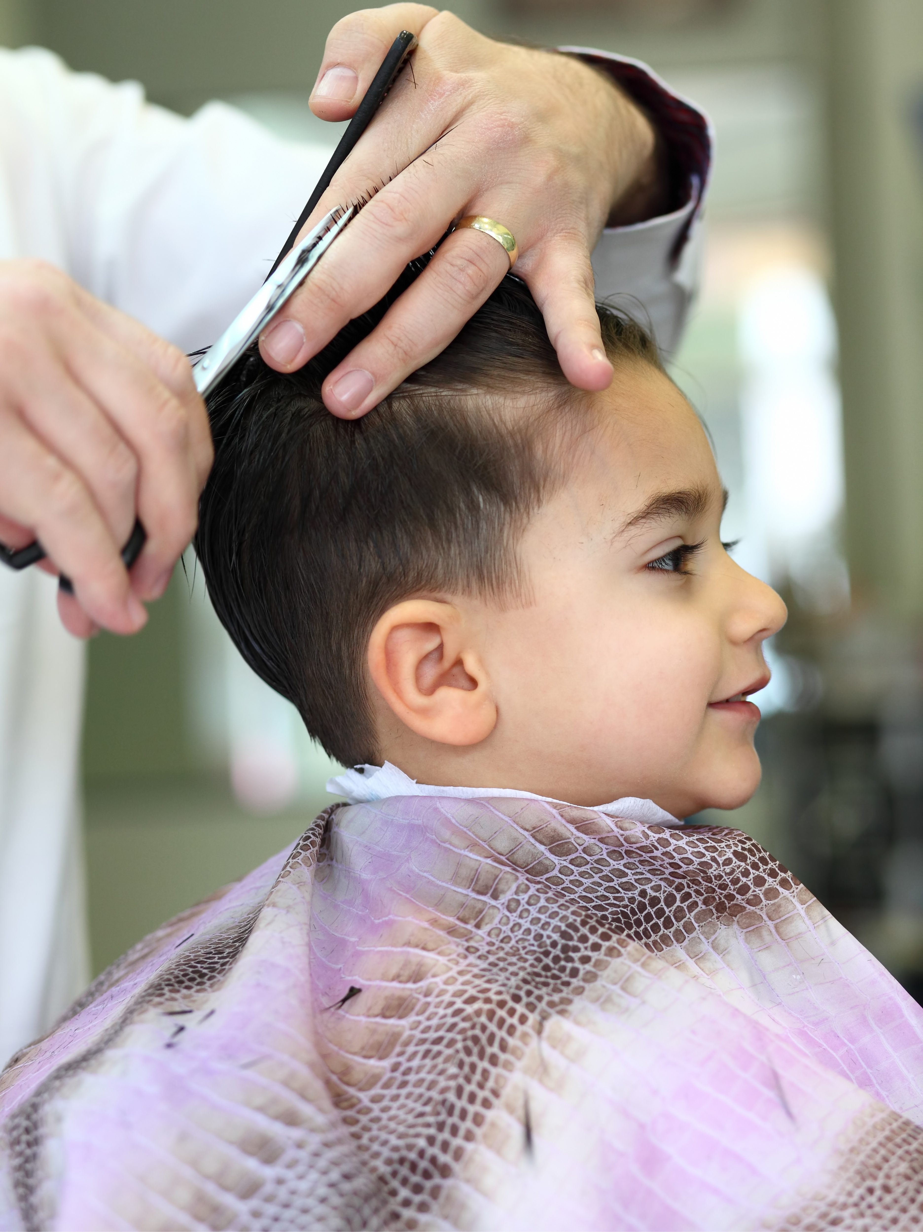 A little boy getting a kids haircut in Shirley, NY from Lemon Tree Shirley.